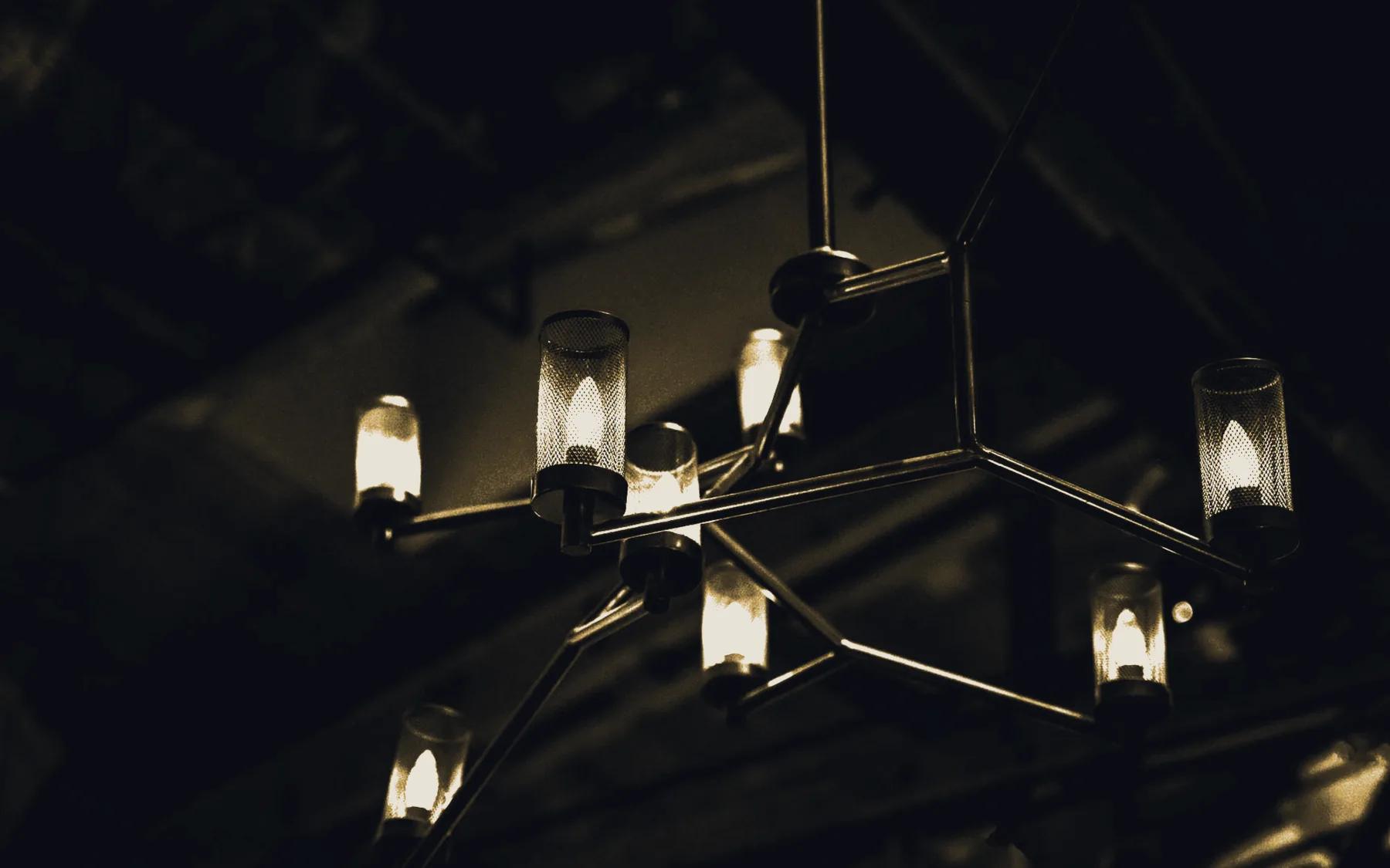 A lit chandelier above the main room
